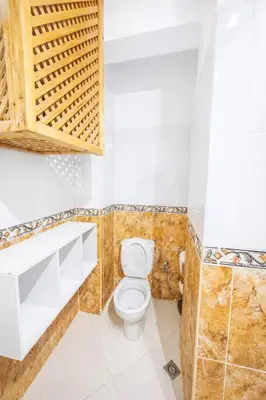 a bathroom with a toilet and a sink at Luxe Studio 2min Carre Eden in Marrakech