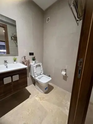 a bathroom with a toilet and a sink at Cozy Apartment With Pool 5 min from Guéliz in Marrakech