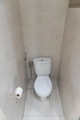 a bathroom with a toilet and a roll of toilet paper at Appartement de luxe, à 2min de Guéliz in Marrakech
