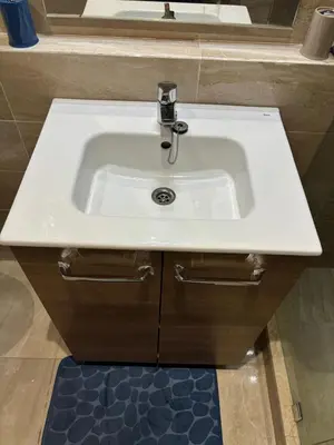 a white sink in a bathroom with a mirror at Gemütliche Wohnung in Marakesch in Marrakech