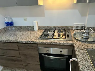 a kitchen with a stove and a counter top at Gemütliche Wohnung in Marakesch in Marrakech