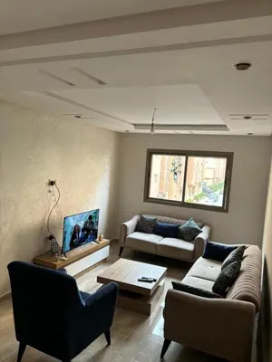 a living room with two couches and a coffee table at Gemütliche Wohnung in Marakesch in Marrakech