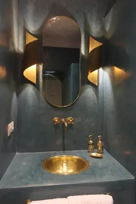 a bathroom with a gold sink and a mirror at DeaRiad, Medina, Basin, 2 Bedrooms in Marrakech