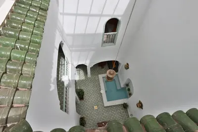 an overhead view of a staircase in a house with a pool at DeaRiad, Medina, Basin, 2 Bedrooms in Marrakech
