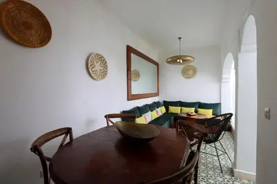 a living room with a table and a couch at DeaRiad, Medina, Basin, 2 Bedrooms in Marrakech