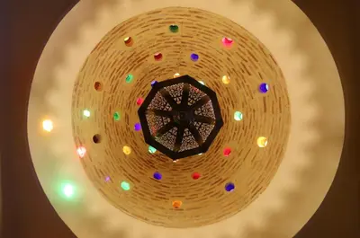 a round mirror with colorful lights on it at Riad La Tulipe, private, 4 Ch, medina in Marrakech