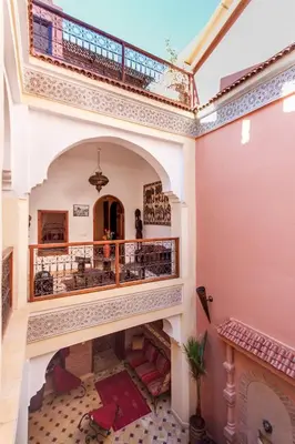 an ornate hallway with a staircase in a building at Dar Jena, Rare Riad in Medina on Mamounia in Marrakech