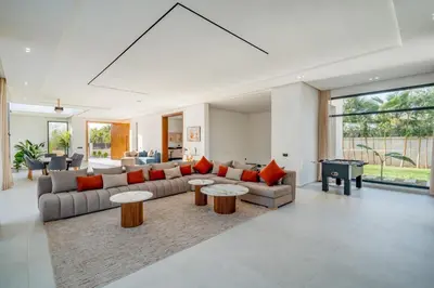 a living room with a couch and a table at Villa Alia - Piscine Chauffée - 4 BR BA - Wifi - Parking in Marrakech