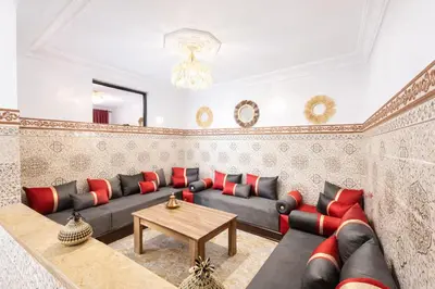 a living room with a couch and a table at 2 bedroom apartment in heart of Madina in Marrakech