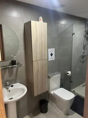 a small bathroom with a toilet and a sink at malak g7 in Marrakech
