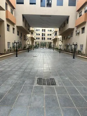 an empty courtyard of an apartment building at malak g7 in Marrakech