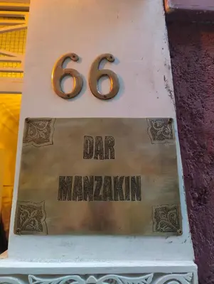 a sign for a bar on top of a cake at Dar Manzakin in Marrakech