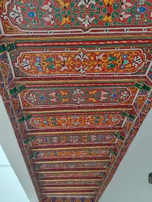 a ceiling of a building with colorful designs on it at Dar Manzakin in Marrakech