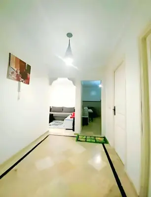 a room with a hallway with white walls at سكن امن وهادى in Marrakech