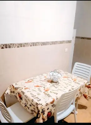 a dining room table with a tablecloth on a table at سكن امن وهادى in Marrakech