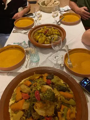 a table with two plates of food on it at Riad 24 in Marrakech