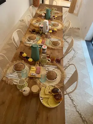 a long table with many plates of food on it at Riad 24 in Marrakech