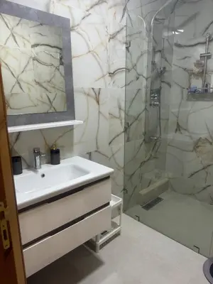 a bathroom with a sink and a shower at Charming Two-Bedroom Apartment in Gueliz,Marrakesh in Marrakech