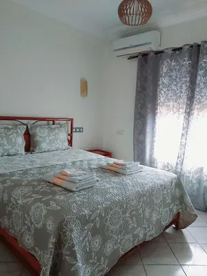 a bedroom with a bed with towels on it at Cute affordable apartment in Marrakech