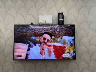 a flat screen tv with a man on it at Apartment in Marrakesh in Marrakech
