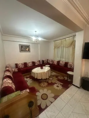 a living room with a couch and a table at Appartement Layane 2 chambres 8 mn de gueliz in Marrakech