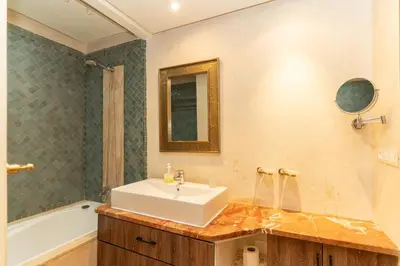 a bathroom with a sink and a mirror at Marrakech Private Pool Villa in Marrakech