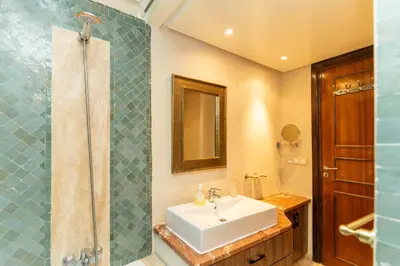 a bathroom with a sink and a shower at Marrakech Private Pool Villa in Marrakech