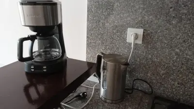 a coffee maker sitting on a counter next to a coffee pot at Cosy and spacious apartment in Gueliz in Marrakech