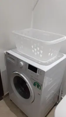 a washing machine with a basket on top of it at Cosy and spacious apartment in Gueliz in Marrakech