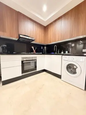 a kitchen with a washing machine and a washer at Appartement au cœur de Marrakech in Marrakech