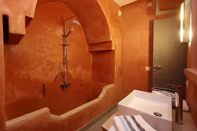 a bathroom with a shower and a toilet and a sink at Souffle d 'Orient, easy access to medina & basin in Marrakech