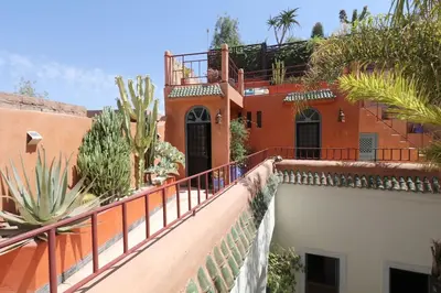 a house with a balcony with plants on it at Riad Al Kamar, private, 2 min from Jema El Fna Square in Marrakech