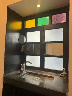 a kitchen with a sink and a window at Riad Maiya in Marrakech