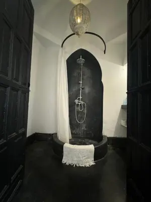 a room with a stand with a picture of a medal at Riad Maiya in Marrakech