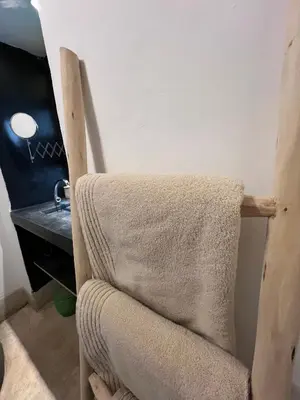 a chair in a room with a desk and a desk at Riad Maiya in Marrakech