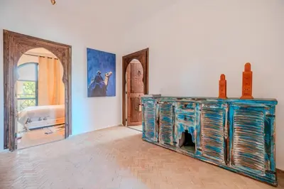 a room with a blue cabinet and a mirror at Villa d Exception 5 suites et piscine privee in Marrakech