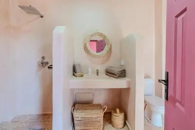 a bathroom with a sink and a mirror and a toilet at Villa d Exception 5 suites et piscine privee in Marrakech
