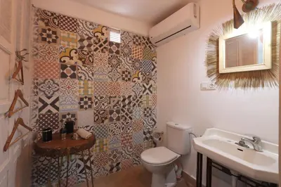 a bathroom with a toilet and a sink at Dar Bensuh 2ch privé in Marrakech