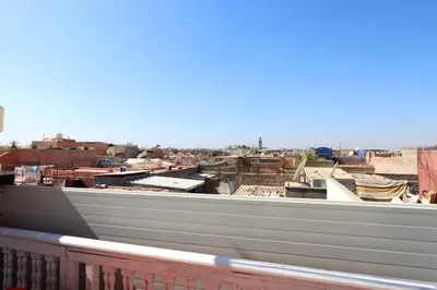 a view of a city from a balcony at Dar Bensuh 2ch privé in Marrakech