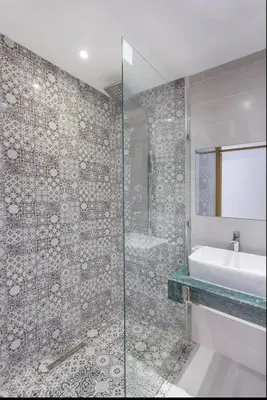 a bathroom with a shower and a sink and a tub at Urban Chic 2 bedrooms in Utimate City Center in Marrakech