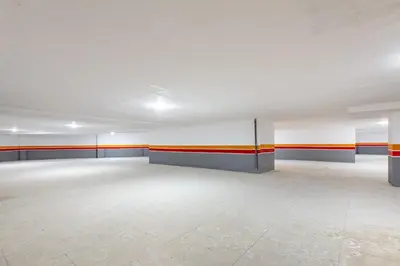 an empty room with orange and blue stripes on the walls at New 1BR appt in gueliz in Marrakech