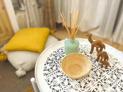 a table with a vase and figurines on it at Comfort bubble ideally located in Guéliz in Marrakech