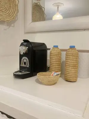 a toaster and two baskets on a counter at Comfort bubble ideally located in Guéliz in Marrakech