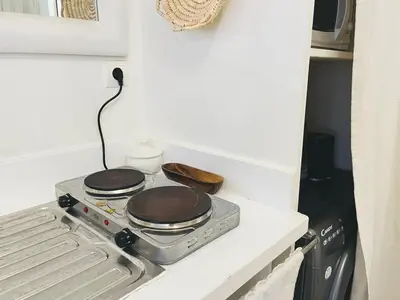 a stove top with two pans on top of it at Comfort bubble ideally located in Guéliz in Marrakech