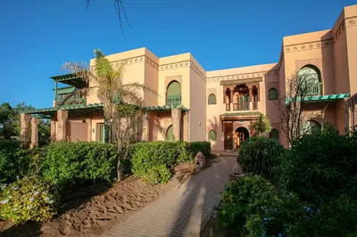 a large house with a road in front of it at Marrakech Palmeraie 2 appt 2ch, résidence avec piscine in Marrakech