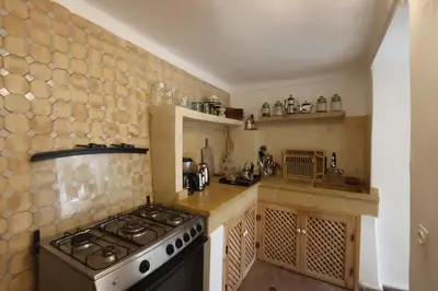 a kitchen with a stove and a stove top oven at Riad L'Hana, 3 ch, exclu medina in Marrakech