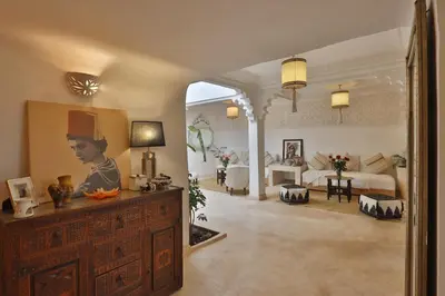 a large living room with a living room with aintendent at Riad L'Hana, 3 ch, exclu medina in Marrakech