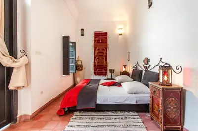 a bedroom with a large bed in a room at Riad XCIX, basin, 3 bedrooms in Medina excluded in Marrakech