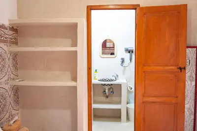 a bathroom with a sink and a toilet in a room at Smile Hostel in Marrakech