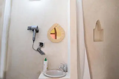 a bathroom with a sink and a shower at Smile Hostel in Marrakech